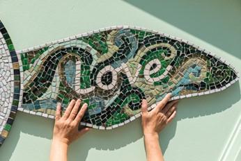 grenfell mosaic with hand