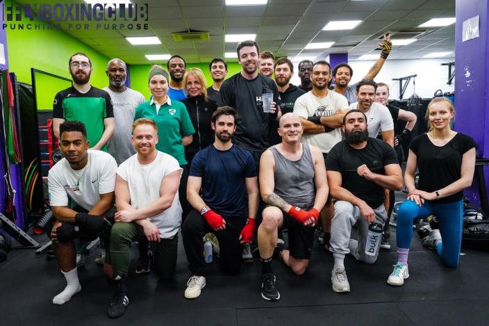 group of people in boxing gym